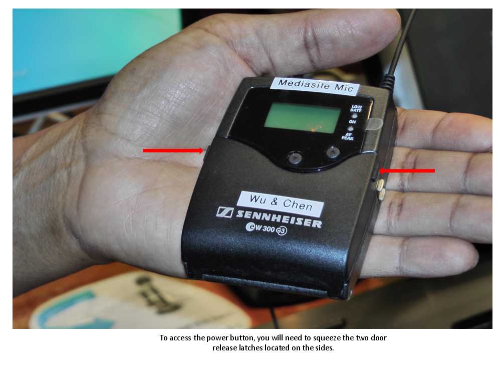 Squeeze the release latches on each side to access the power button